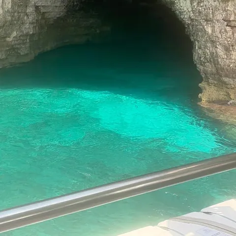 A sea cave with turquoise water at Comino