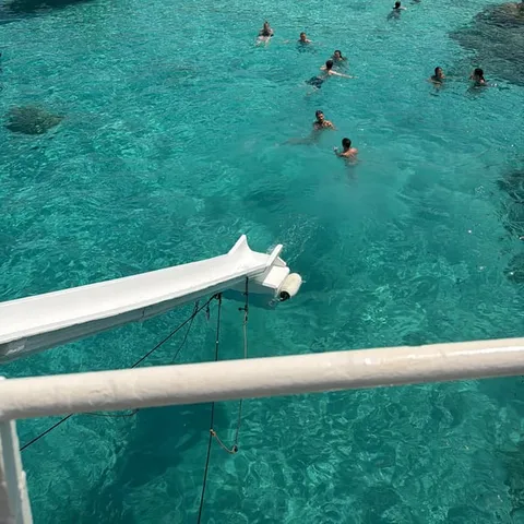 Swimmers and boats in the Blue Lagoon