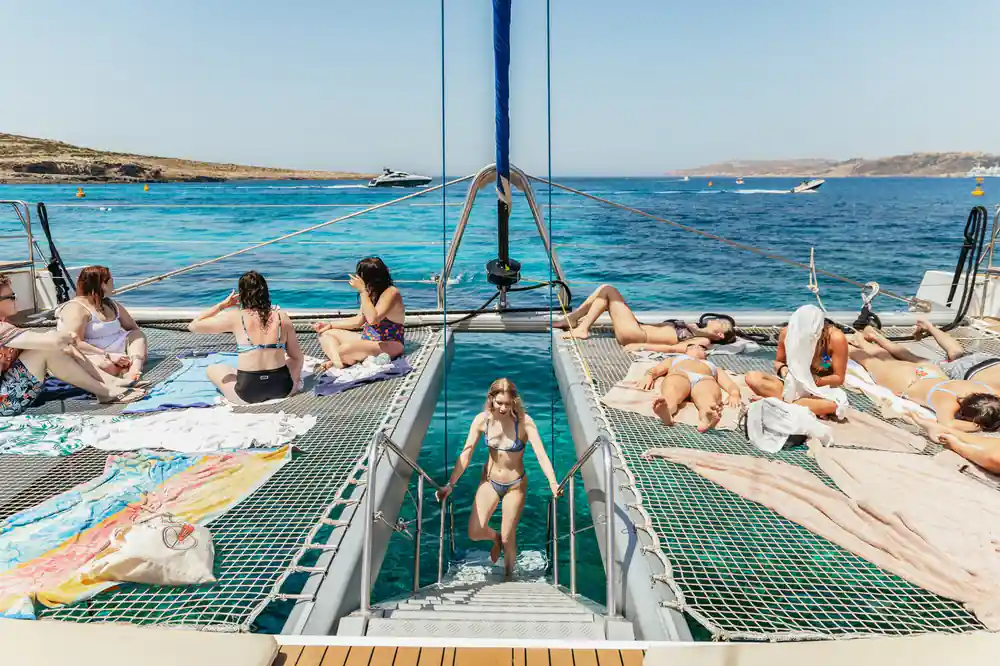 The view forward down the deck to the nets, passengers spread across both