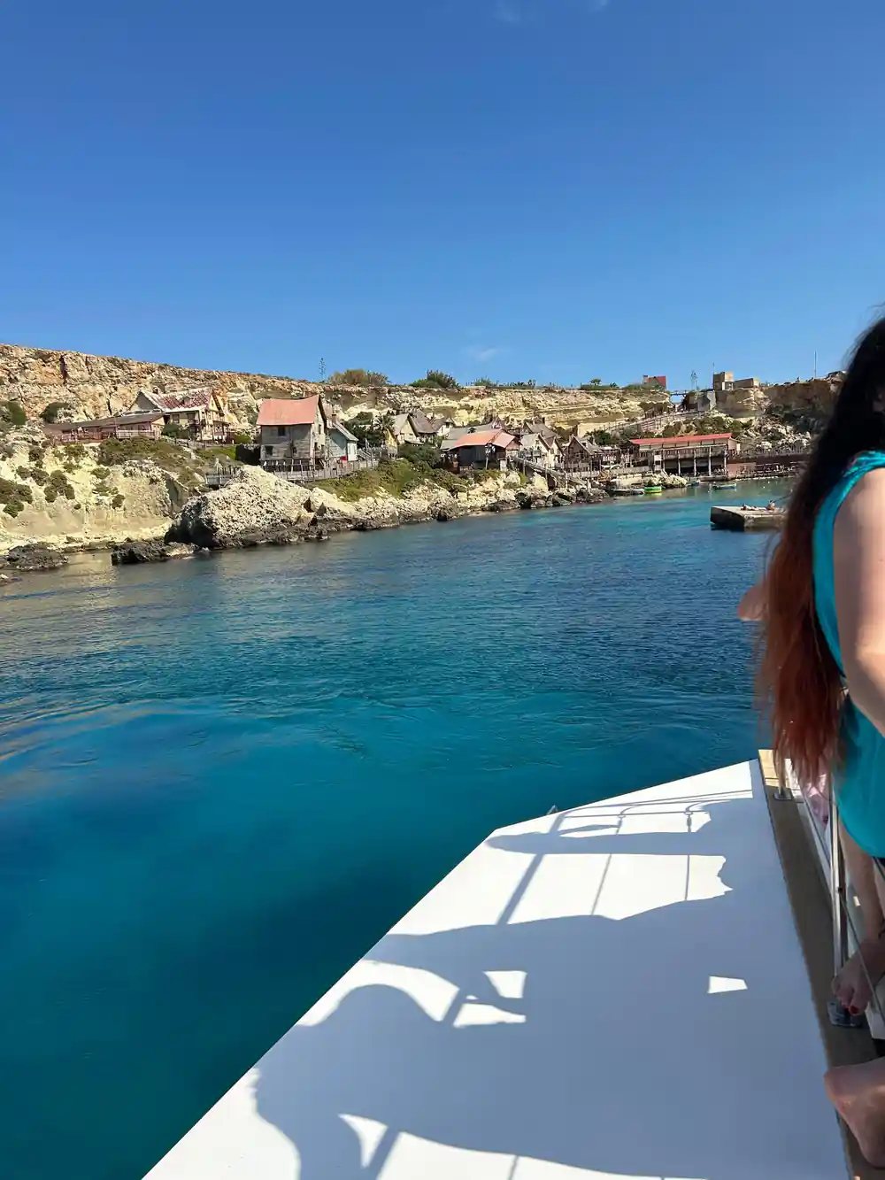 The wooden village of Anchor Bay seen from the water